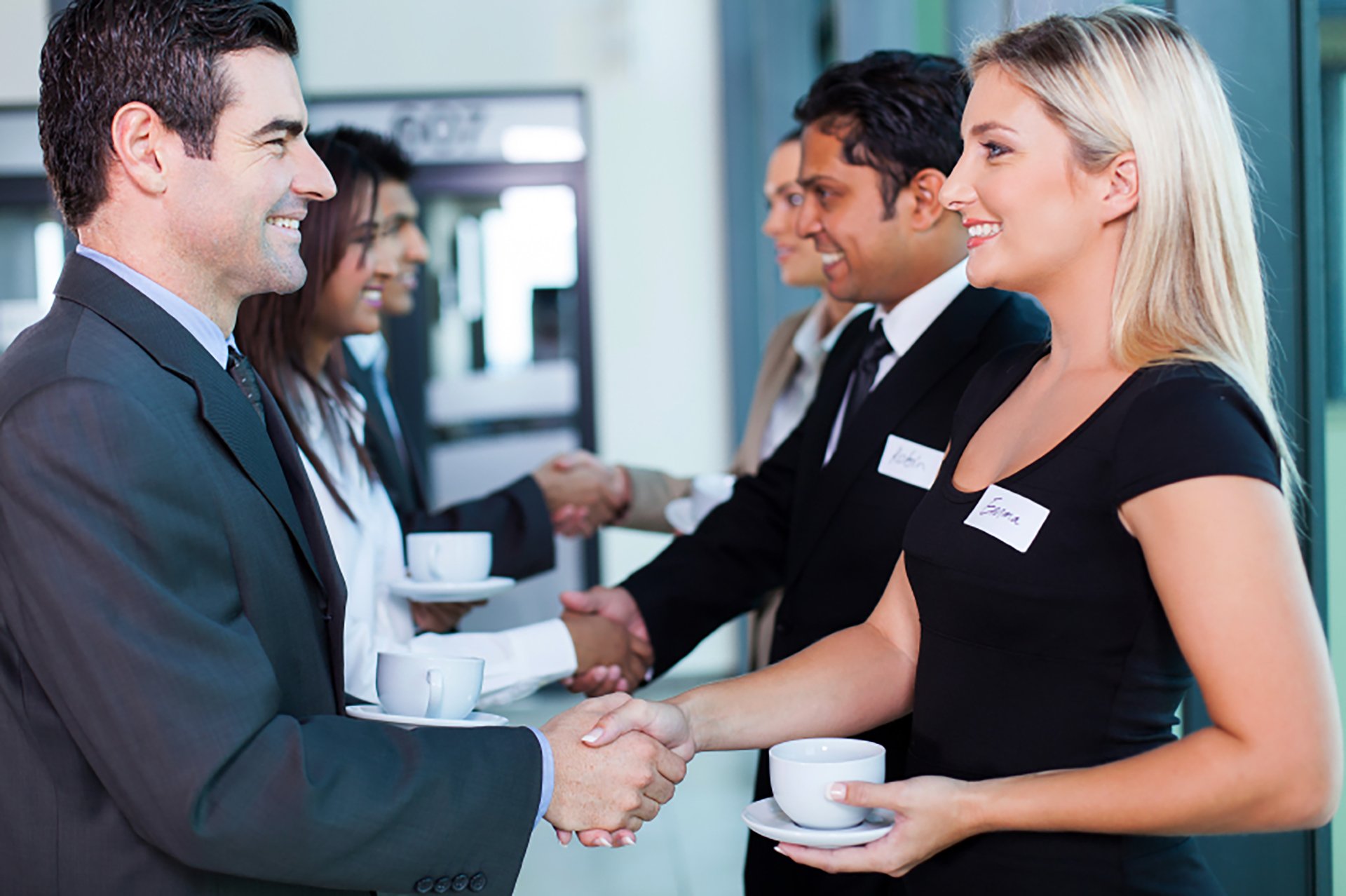 group of business people handshaking during seminar